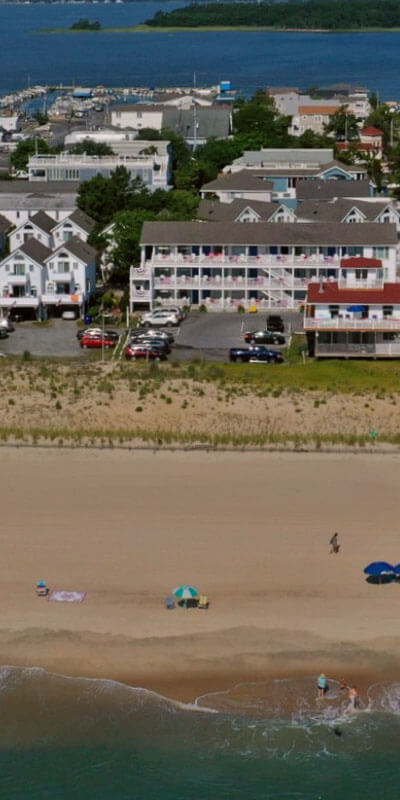 An establishing shot of the shore and motels along Dewey Beach.
